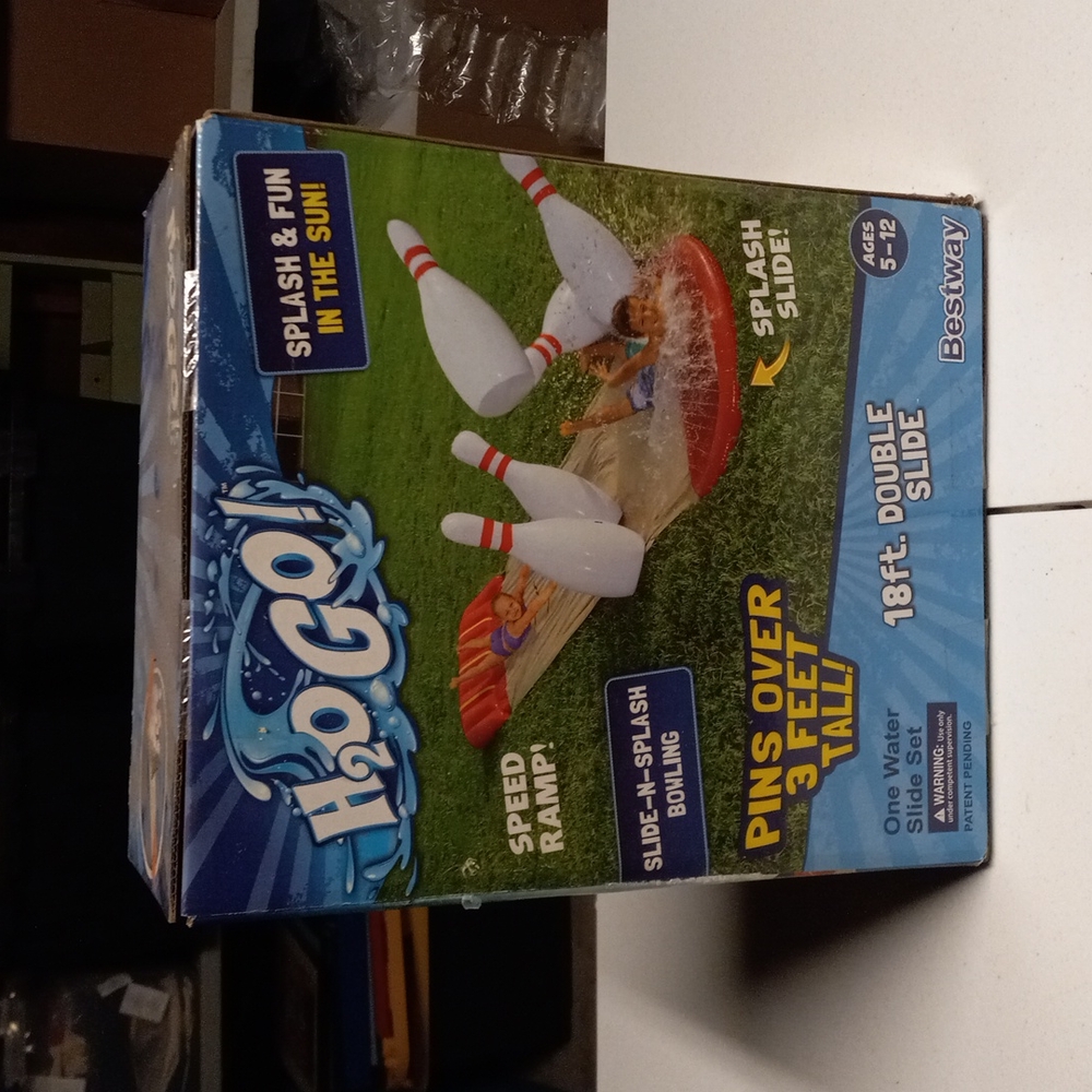 Blow up bowling slip and slide water game